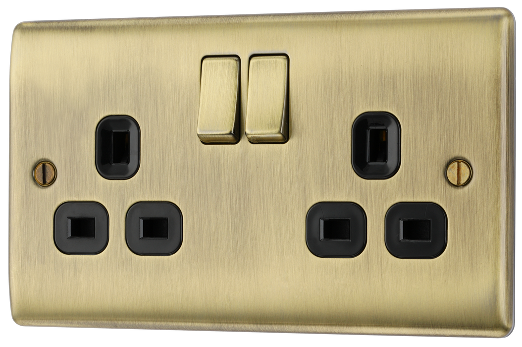 NAB22B Front - This antique brass finish 13A double switched socket from British General has a sleek and slim profile with softly rounded edges and no visible plastic around the switches to add a touch of luxury to your decor.