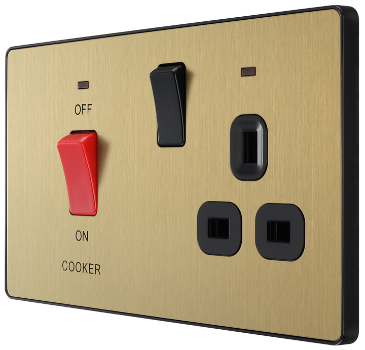 PCDSB70B Front - This Evolve Satin Brass 45A cooker control unit from British General includes a 13A socket for an additional appliance outlet, and has flush LED indicators above the socket and switch.